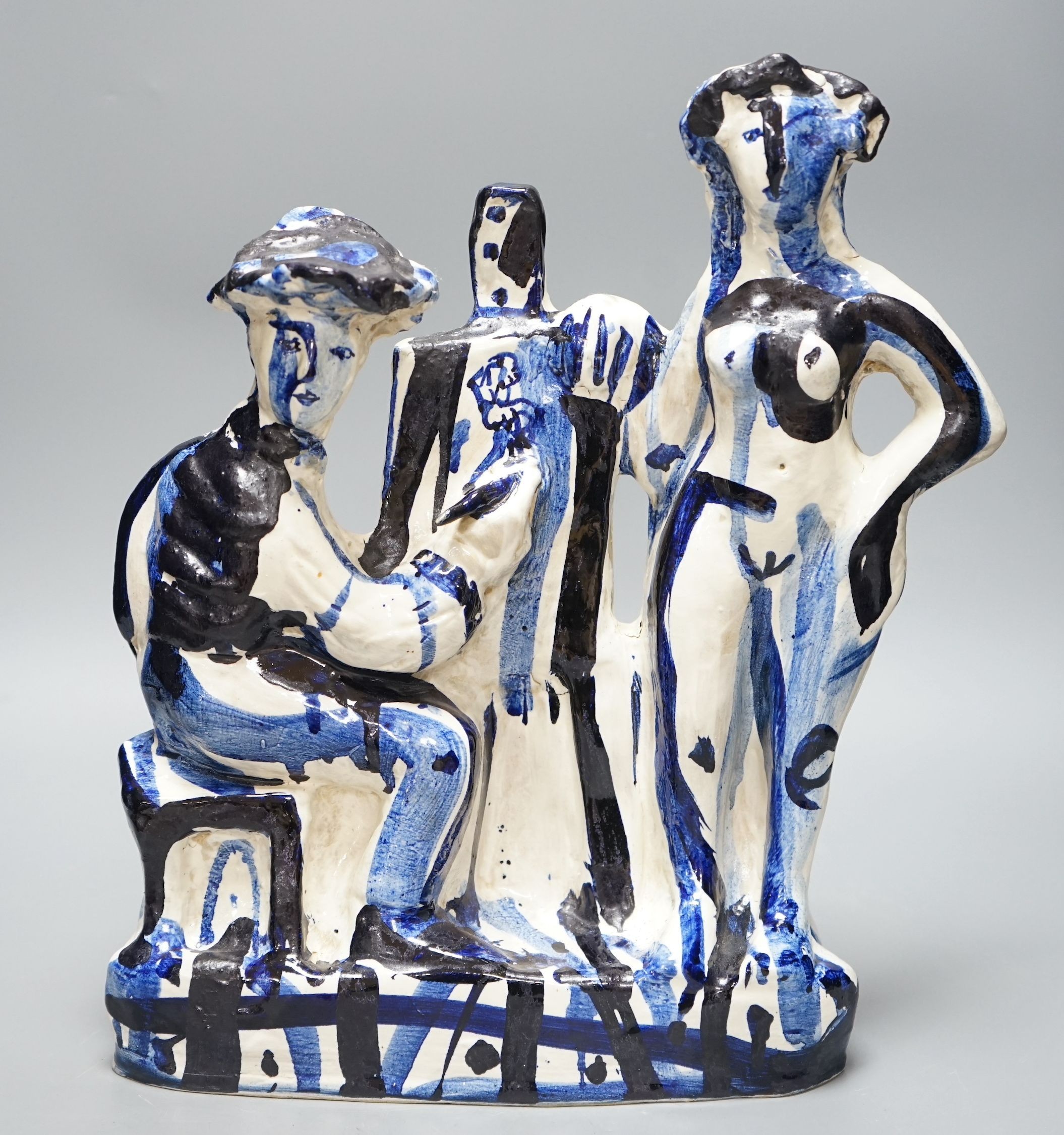After Picasso, a tin-glazed blue and white figural studio pottery group of an artist and their muse, 37cm tall